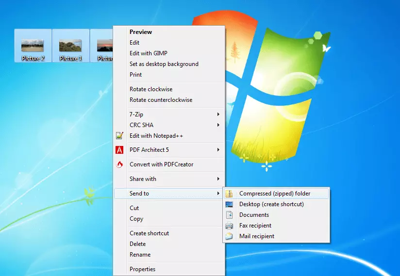 Captura de pantalla del escritorio de Windows en el que se procede a comprimir diferentes archivos separados en una sola carpeta